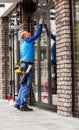 Window washer working at building outdoor