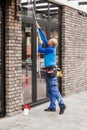 Window washer working at building outdoor