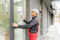 window washer working wash glass on building