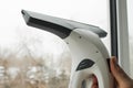 Window washing with a vacuum cleaner Royalty Free Stock Photo