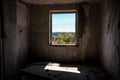 Window from weathered abandoned room to sunny day Royalty Free Stock Photo