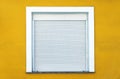 Window with white rolling shutter. Royalty Free Stock Photo
