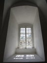 Window in white stone wall with lattice Royalty Free Stock Photo