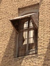 Window with wood roof at the top