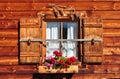 window of a wooden alpine cottage with shutt Royalty Free Stock Photo