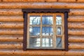 The window in the wooden building of the Russian Orthodox Church with a cross Royalty Free Stock Photo
