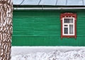 The window with the wooden carved architrave in the house