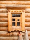 Window in wooden log house in Russian village in the middle Russ