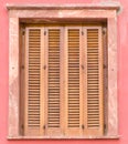 Window with wooden louver shutters