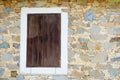 Window with wooden shutters of an old house in Phicardou Fikardou village, Cyprus Royalty Free Stock Photo