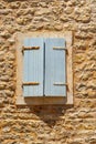 window with wooden shutters, street view of the old town of Budva in Montenegro, medieval European architecture, city streets, red Royalty Free Stock Photo