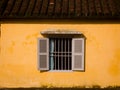 Window in Yellow Wall