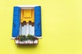 Window on a yellow wall background. Copy space. Royalty Free Stock Photo