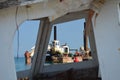 Through the windows of abandoned ruined boat