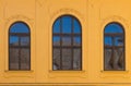 Windows with an arch with sky reflection Royalty Free Stock Photo