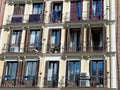 Windows and balconies on aged apartment building block in Lavapies district, Madrid, Spain Royalty Free Stock Photo