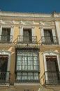 Windows with balcony on old building of Merida