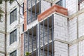 Windows, balcony and walls on construction site of multi storey building. Modern civil engineering. Buildings industry. Urban Royalty Free Stock Photo