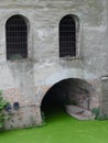 Windows and boat entrance of a castle moat looks like a face