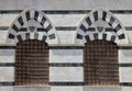 Windows of a building in the Piazza del Duomo of Siena, Italy