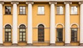 Windows and columns in a row on facade of apartment building Royalty Free Stock Photo