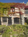 Windows and doors with bars on an old stone house at medieval vi Royalty Free Stock Photo