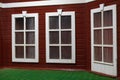 Windows in English style. Fire station building on playground. Details of game room