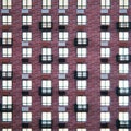 Windows on the facade of the brown building, background. Close-up layout of the house