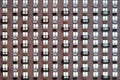 Windows on the facade of the brown building, background. Close-up layout of the house