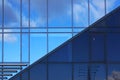 Windows on facade of modern building. Reflection of sky in windows glass Royalty Free Stock Photo