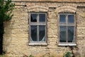 Windows and facade on old abandoned house Royalty Free Stock Photo