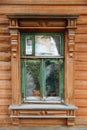 Windows on the facade of an old wooden house is in disrepair. A house in the village. Russia. Royalty Free Stock Photo