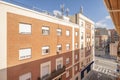 Windows on the facade of a residential building with several mobile p