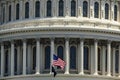 Windows and flag of the dome of the capitol of the United States of America, located in Washington DC which is the federal capital