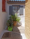 Windows and flowerpots at  Anafiotika, Athens Greece, Royalty Free Stock Photo