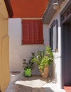 Windows and flowerpots at  Anafiotika, Athens Greece, Royalty Free Stock Photo
