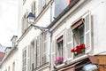 Windows with flowers on Montmartre street Royalty Free Stock Photo