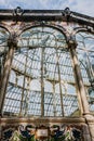 Windows of the glass palace of the Retiro Park in Madrid, with a background of a sky with clouds Royalty Free Stock Photo