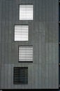 Windows on Grey Wall. Fragment of Facade of Modern Building. Arhitectural Background Royalty Free Stock Photo