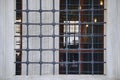 The windows with Islamic motifs and lattices on the outer walls of an ancient mosque belonging to the Ottoman period.