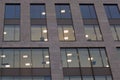 Windows in a large modern office building illuminated at night Royalty Free Stock Photo