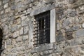 Windows with metal grilles, view from the street Royalty Free Stock Photo