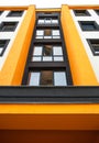 Windows of a modern building with orange walls Royalty Free Stock Photo