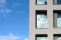 Windows in a modern office block reflect the sky Royalty Free Stock Photo