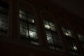 Windows at night. Light in windows in evening. Building outside in dark