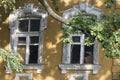 Windows of an old abandoned house. The architectural monument is in need of repair or restoration Royalty Free Stock Photo