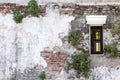 Windows on the old brick wall and old gray cement wall with crac Royalty Free Stock Photo