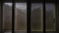 Windows with old retro wooden shutters through which the sun`s rays penetrate Royalty Free Stock Photo