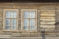 the windows of an old wooden dilapidated house.