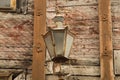 Windows of the old wooden house. wooden wall with vintage lamp